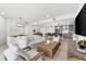 Open-concept living space connects the living room, dining area, and modern kitchen for seamless flow at 1035 Seaside Dr # 308, Sarasota, FL 34242
