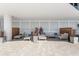 Comfortable outdoor patio with lounge chairs and stylish seating area at 1035 Seaside Dr # 308, Sarasota, FL 34242