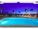 Outdoor pool, surrounded by lounge chairs, overlooking the beach at 1035 Seaside Dr # 308, Sarasota, FL 34242