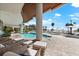 Gorgeous beachfront pool with ample seating and palm trees at 1035 Seaside Dr # 308, Sarasota, FL 34242