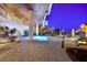 Outdoor pool and lounging area with palm trees and ocean view at 1035 Seaside Dr # 308, Sarasota, FL 34242