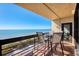 Enjoy breathtaking ocean views from this condo's spacious, private balcony with table and chairs at 1055 Gulf Of Mexico Dr # 405, Longboat Key, FL 34228
