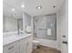 Bathroom with walk-in shower and single marble vanity sink at 1055 Gulf Of Mexico Dr # 405, Longboat Key, FL 34228
