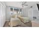 Bedroom with twin beds, laminate floors, and ample closet space at 1055 Gulf Of Mexico Dr # 405, Longboat Key, FL 34228