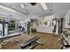 Bright gym space with weight machines, free weights, and inspiring sports-themed decor at 1055 Gulf Of Mexico Dr # 405, Longboat Key, FL 34228