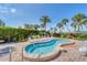 Inviting hot tub with brick patio and landscaping, offering a relaxing experience for Beachplace residents at 1055 Gulf Of Mexico Dr # 405, Longboat Key, FL 34228