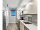 Modern kitchen features quartz countertops, stainless steel appliances, and ample cabinet space at 1055 Gulf Of Mexico Dr # 405, Longboat Key, FL 34228