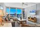 The stylish living room boasts ocean views, comfortable seating, and a flat-screen TV for relaxation at 1055 Gulf Of Mexico Dr # 405, Longboat Key, FL 34228