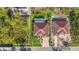 Aerial shot of the stunning property with a large home, guest house, pool, and beautiful landscaping at 115 Solana St, North Port, FL 34287