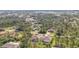 Lovely aerial view of neighborhood homes surrounded by trees and lush greenery at 115 Solana St, North Port, FL 34287