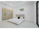 Minimalist bedroom featuring an abundance of natural light, sleek tile floors, and custom closet with ample storage at 115 Solana St, North Port, FL 34287