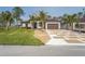 Beautiful single Gathering home with an attractive lawn, rock landscaping, and a decorative concrete driveway at 115 Solana St, North Port, FL 34287