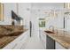 Well-appointed kitchen featuring modern appliances, a large island, and sleek design at 115 Solana St, North Port, FL 34287