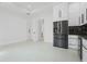 Open kitchen area featuring stainless steel appliances and white cabinetry at 115 Solana St, North Port, FL 34287