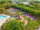 Community amenities include swimming pool, playground, tennis court, basketball court, surrounded by trees at 12736 Penguin Dr, Bradenton, FL 34212