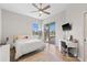 Bright bedroom with tile flooring, a ceiling fan, and sliding glass doors that lead to a private pool area at 12736 Penguin Dr, Bradenton, FL 34212