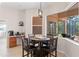 Cozy breakfast nook features a round table, large window with a view, and a coffee bar at 12736 Penguin Dr, Bradenton, FL 34212