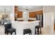 Well-designed kitchen with wood cabinets, stainless steel appliances, and a breakfast bar at 12736 Penguin Dr, Bradenton, FL 34212