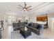 Spacious living room with an open floor plan, neutral colors, and seamless transition to other living spaces at 12736 Penguin Dr, Bradenton, FL 34212