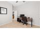 This office features tile floors, a computer desk with drawers, and a comfortable executive-style rolling chair at 12736 Penguin Dr, Bradenton, FL 34212