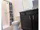 Bathroom with walk-in shower, modern vanity with granite countertop, and toilet at 13393 Golden Lime Ave, Spring Hill, FL 34609