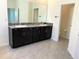 Bathroom features double sink vanity with granite countertop and access to water closet at 13393 Golden Lime Ave, Spring Hill, FL 34609