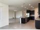 A kitchen with dark cabinets, granite countertops, stainless steel appliances, and an island at 13393 Golden Lime Ave, Spring Hill, FL 34609