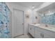 Bright bathroom with double vanity, white cabinets, and a shower with a decorative curtain at 13414 Sunset Sapphire Ct, Parrish, FL 34219