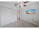 Bedroom featuring a ceiling fan, TV, and closet at 13414 Sunset Sapphire Ct, Parrish, FL 34219