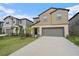 Beautiful two-story home with a two-car garage and well-manicured lawn in a friendly neighborhood at 13414 Sunset Sapphire Ct, Parrish, FL 34219