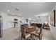 Bright, open-concept living space with island kitchen, dining area, and comfortable seating at 13414 Sunset Sapphire Ct, Parrish, FL 34219