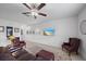 Inviting living room features neutral walls, tile floors, and a ceiling fan for comfortable living at 13414 Sunset Sapphire Ct, Parrish, FL 34219