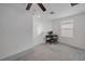 Upstairs room featuring gray carpet, a ceiling fan, and a desk for work at 13414 Sunset Sapphire Ct, Parrish, FL 34219
