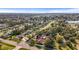 An aerial view of a dense residential neighborhood featuring mature trees and well-maintained properties at 1354 Lucaya Ave, Venice, FL 34285