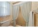 Bathroom with floral wallpaper and a walk-in shower at 1354 Lucaya Ave, Venice, FL 34285