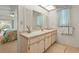 Bathroom vanity with a marble countertop and white cabinetry at 1354 Lucaya Ave, Venice, FL 34285