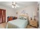 Bedroom featuring a comfortable bed, matching nightstand, and a desk with an office chair at 1354 Lucaya Ave, Venice, FL 34285