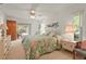 Bedroom with a ceiling fan and dresser with access to the patio at 1354 Lucaya Ave, Venice, FL 34285