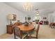 Formal dining area featuring a stunning chandelier and seating for six at 1354 Lucaya Ave, Venice, FL 34285
