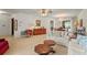 Inviting living room featuring a neutral color palette and dining area beyond at 1354 Lucaya Ave, Venice, FL 34285