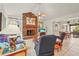 Spacious living room featuring a brick fireplace, tile floors, and natural light at 1354 Lucaya Ave, Venice, FL 34285
