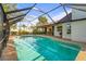 Screened-in pool area featuring clear blue water and a view of the backyard at 1354 Lucaya Ave, Venice, FL 34285