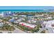 Aerial view of condo complex with red roof, situated in a beach community with beautiful landscaping at 137 Avenida Messina # 3, Sarasota, FL 34242