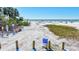 Beach access #3 with public beach access sign to the sandy shoreline at 137 Avenida Messina # 3, Sarasota, FL 34242