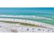 Beautiful ocean view, white sand beach with clear water, and people enjoying the beach lifestyle at 137 Avenida Messina # 3, Sarasota, FL 34242