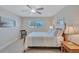 Comfortable bedroom with a view of the outdoors, featuring a cozy bed and stylish decor at 137 Avenida Messina # 3, Sarasota, FL 34242