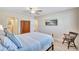 Cozy bedroom with a view of the en-suite bathroom, showcasing light-colored walls and comfortable furnishings at 137 Avenida Messina # 3, Sarasota, FL 34242