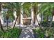 Well maintained condo entrance with lovely palms, tidy landscaping, and shade at 137 Avenida Messina # 3, Sarasota, FL 34242