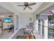 Relaxing screened porch connected to the living area, with comfortable seating and outdoor views at 137 Avenida Messina # 3, Sarasota, FL 34242