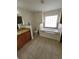 Well-lit bathroom with soaking tub, a walk-in shower, and double vanity at 1402 Jakway Rd, North Port, FL 34288
